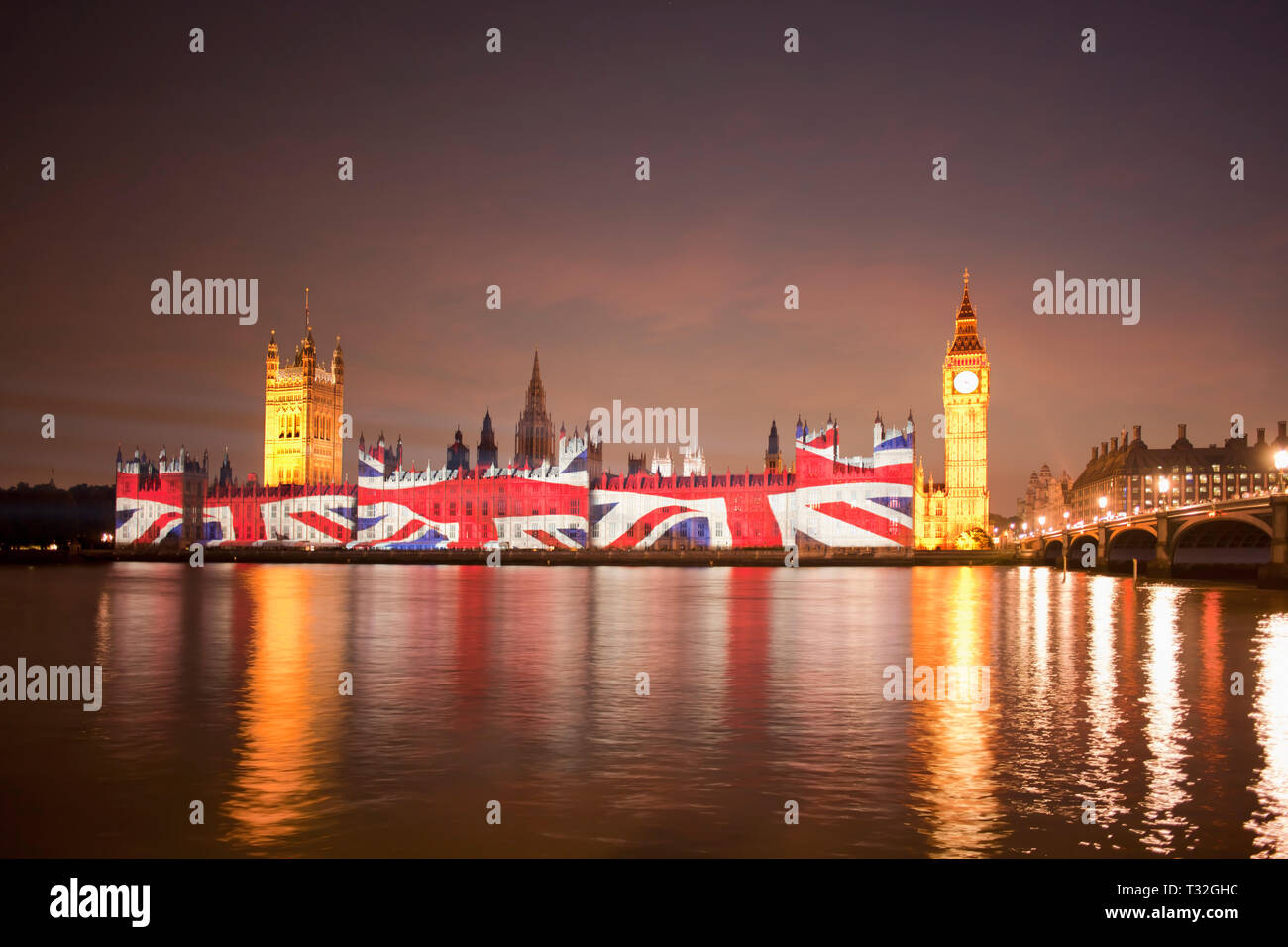 Union Jack Flag projected onto the Houses of Parliament at dusk london england Stock Photo