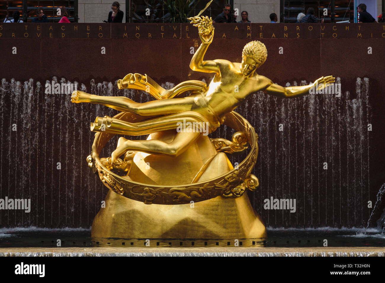 Statue of Prometheus in the lower plaza of the Rockefeller Center, Manhattan, New York, New York State, United States of America.  The gilded bronze s Stock Photo