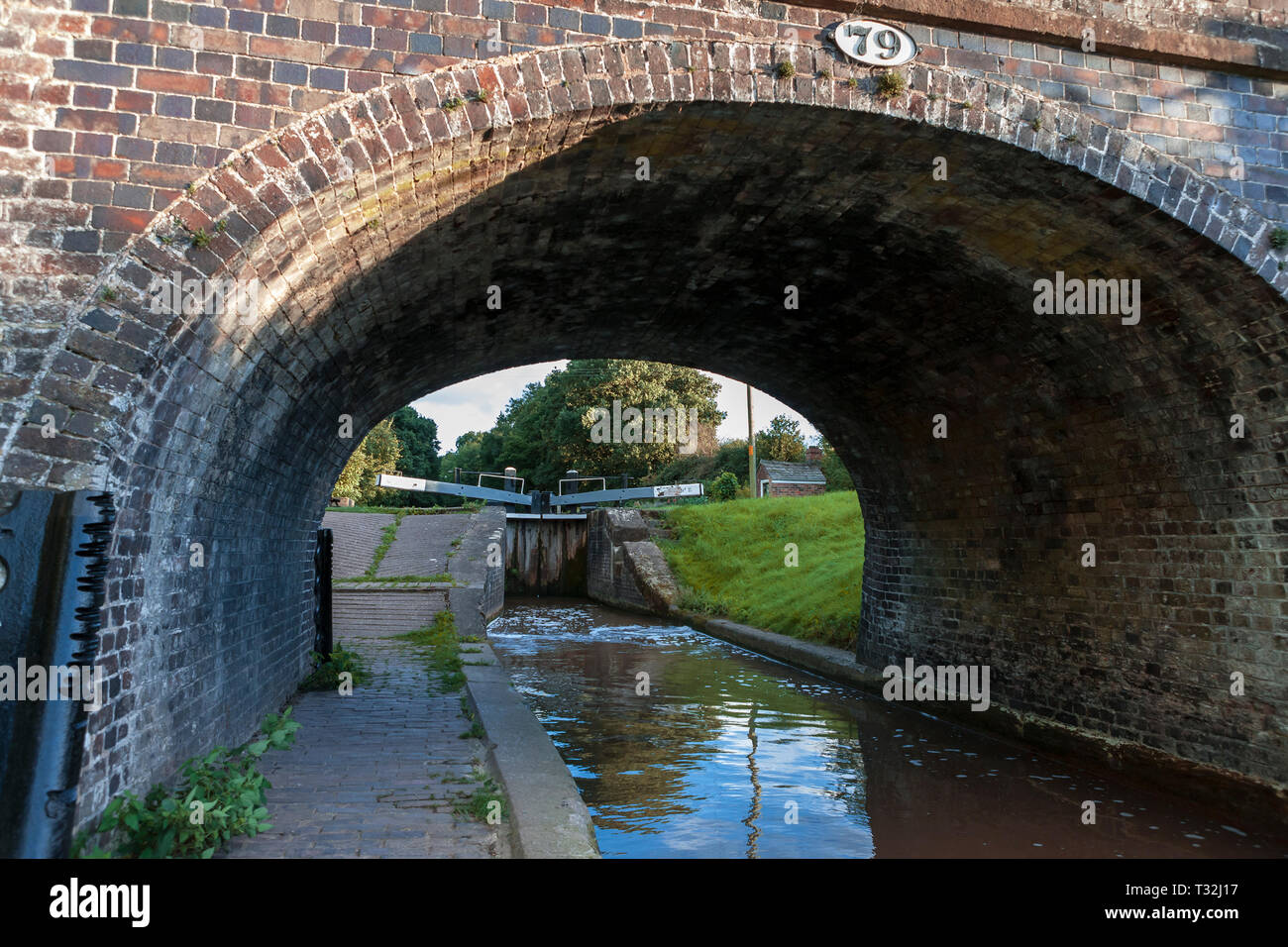 Moss Hall Bridge and Audlem Bottom Lock on the Shropshire Union Canal, Audlem, Cheshire, England Stock Photo