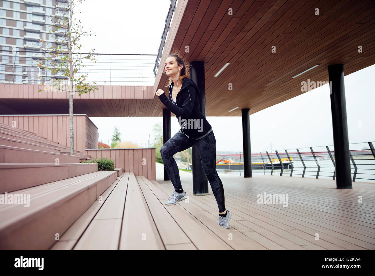Healthy woman running and climbing up on stairs Stock Photo Alamy