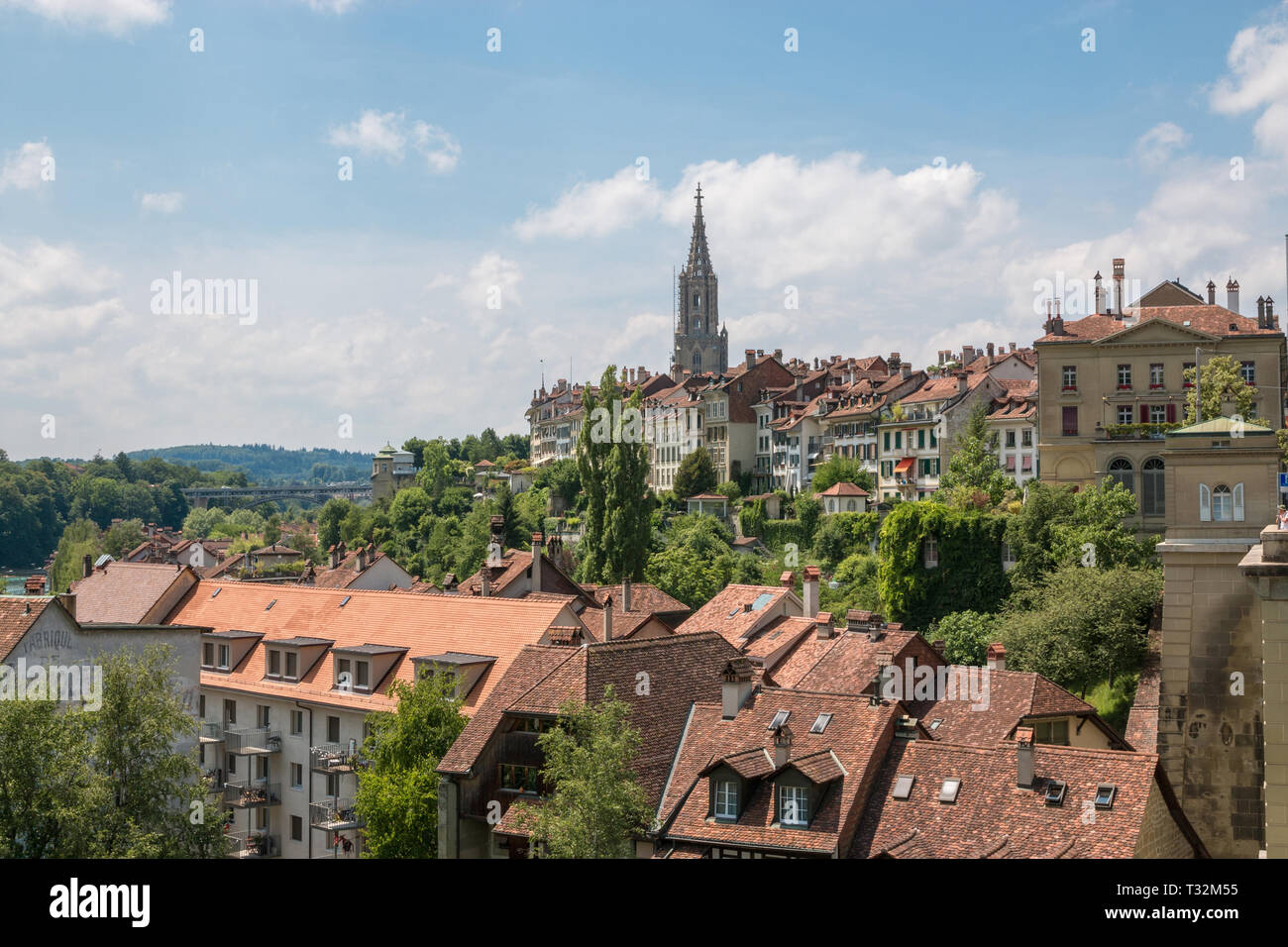 Panoramic view on Bern Minster and historic old town of Bern in Switzerland. Summer landscape, sunny day and blue sky Stock Photo