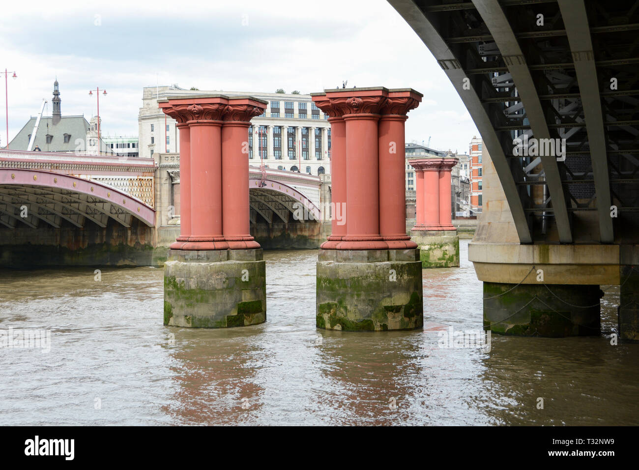 Joseph Cubitt's original Blackfriars Railway Bridge pillars next to the current day Blackfriars Bridge, London, UK Stock Photo