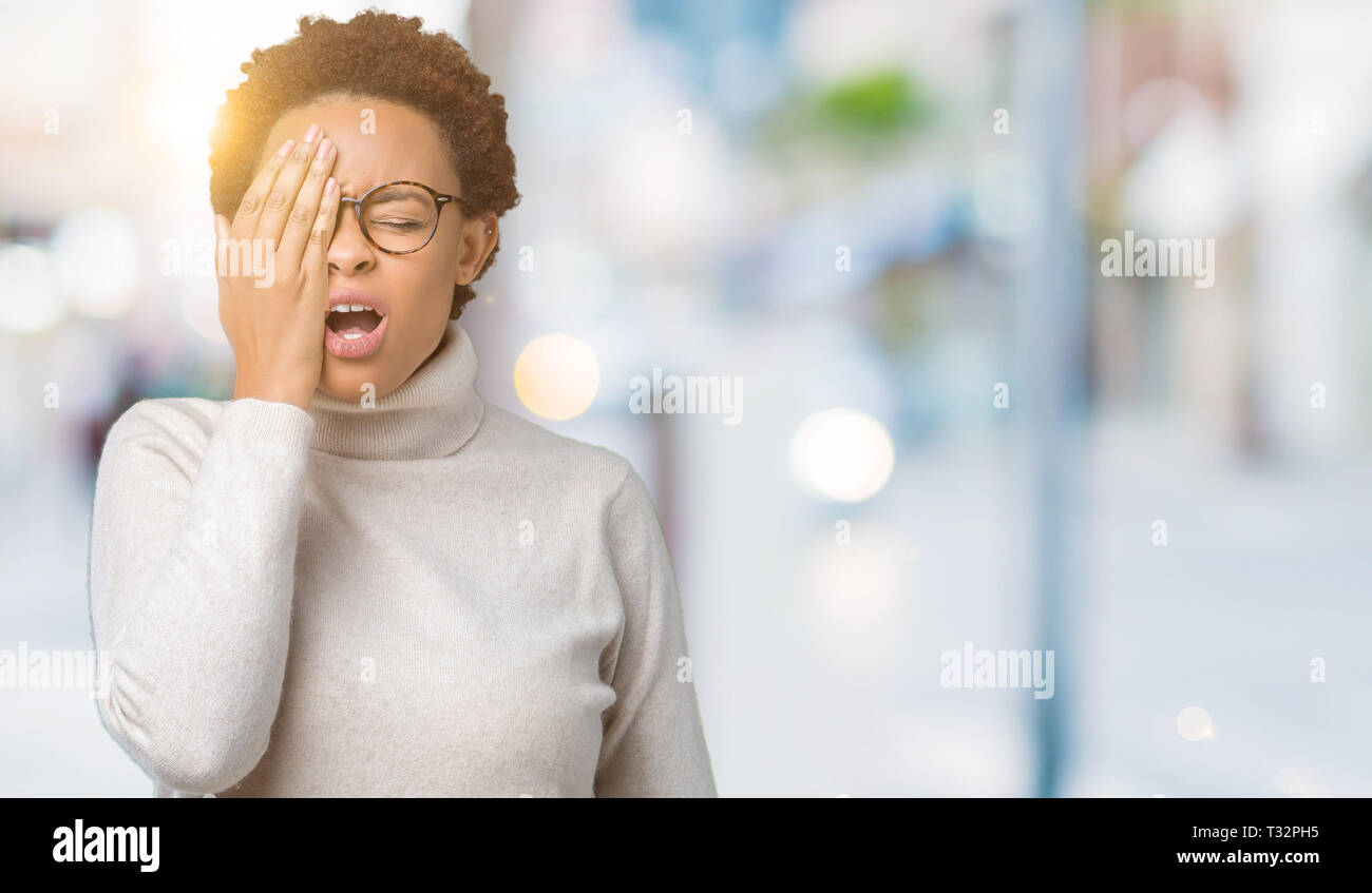 Young beautiful african american woman wearing glasses over isolated