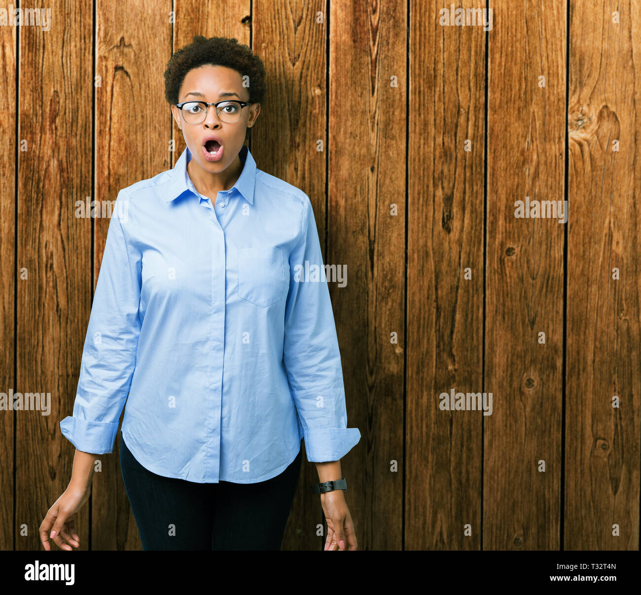 Young beautiful african american business woman over isolated ...