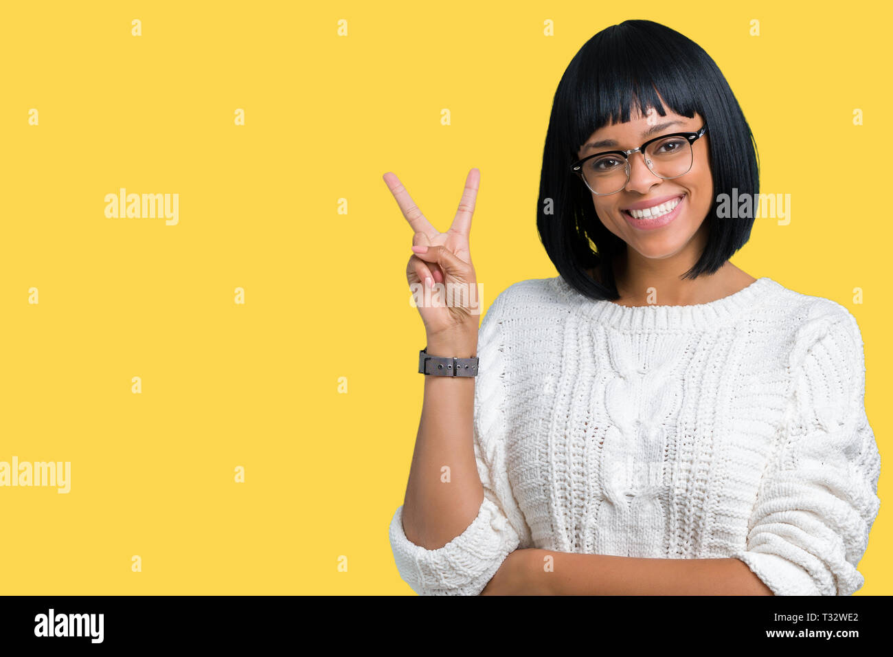 Beautiful young african american woman wearing glasses over isolated ...