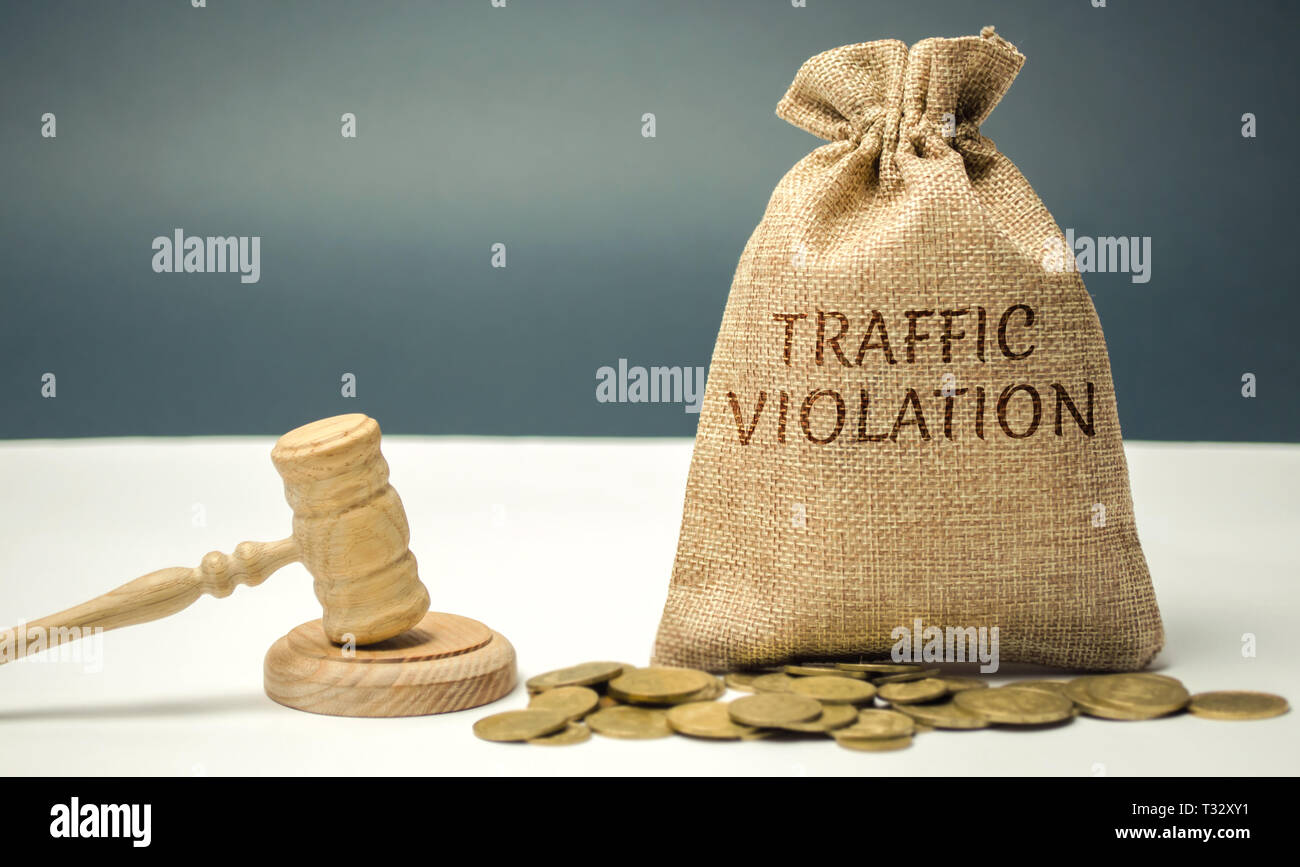 Money bag with the word Traffic violation and the judge #39 s hammer Law Money bag with the word Traffic violation and the judge #39 s hammer Law
