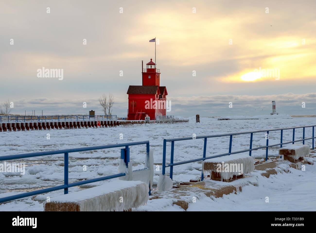 Big Red lighthouse in Holland Michigan in winter at sunset Stock Photo