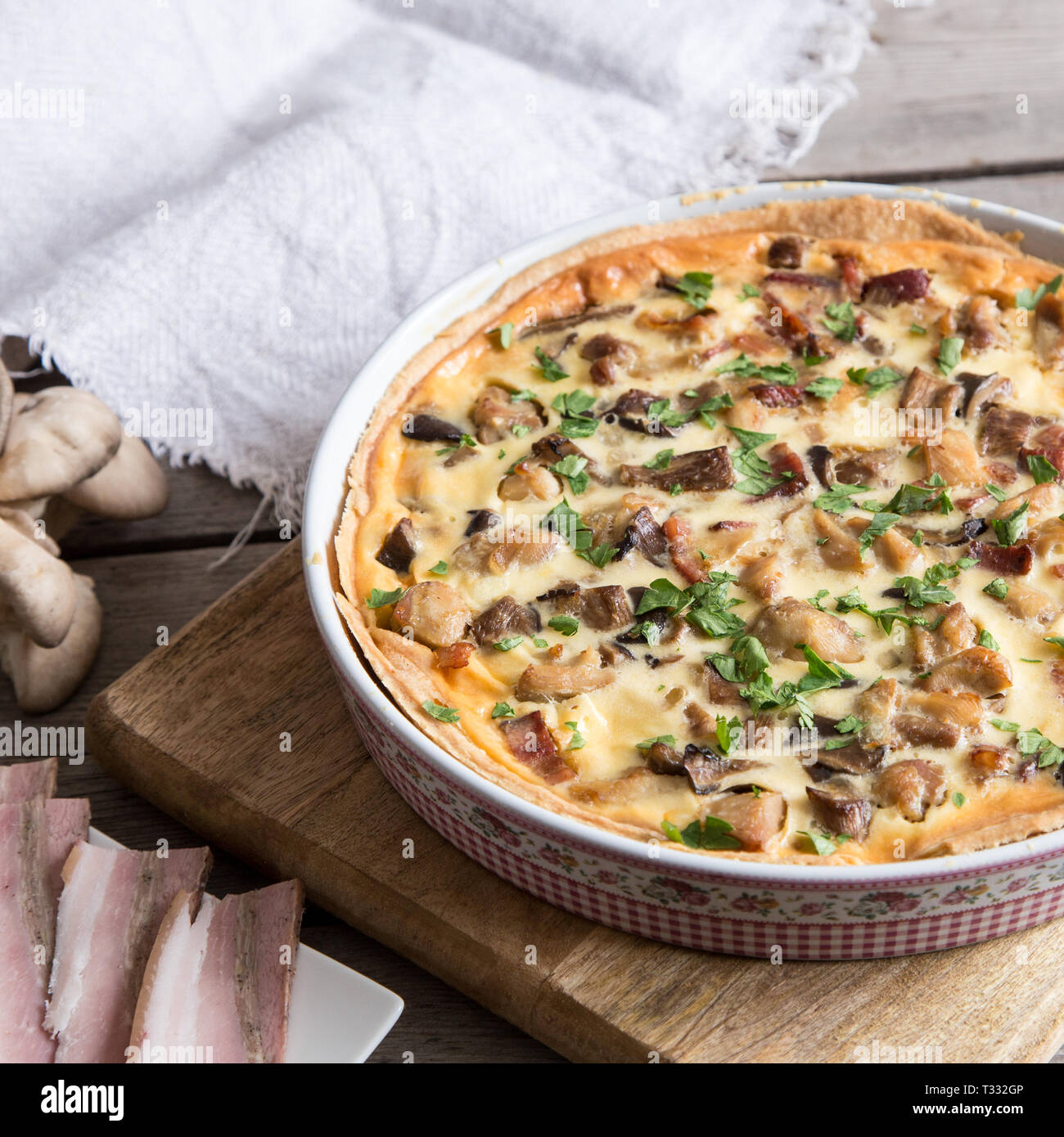 Homemade quiche lorraine with chicken, mushrooms, cheese and bacon. Tart with chicken. Chicken pie. Mushroom pie/ Stock Photo
