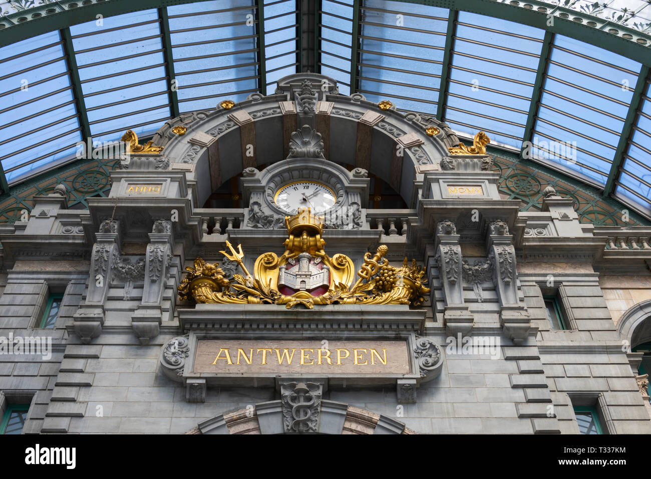 Antwerp, Belgium - July 14, 2018 Large clock in the great Hall of the central station in Antwerp with the name in gold letters of the city Stock Photo