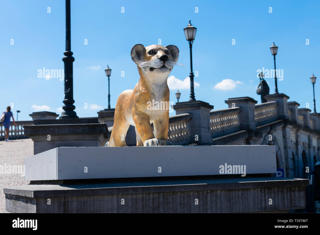 Antwerp, Belgium - July 14, 2018 Statue of a lion cub to the reconstructed poton bridge on the river schelde in Antwerp Stock Photo