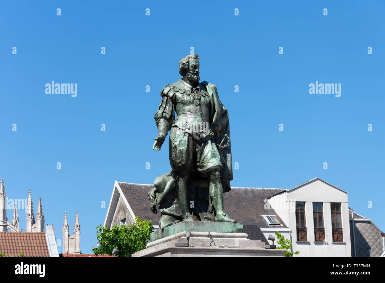 Antwerp, Belgium - July 14, 2018 Statue of painter Peter Paul Rubens in Antwerp with old houses and a blue sky in the background Stock Photo
