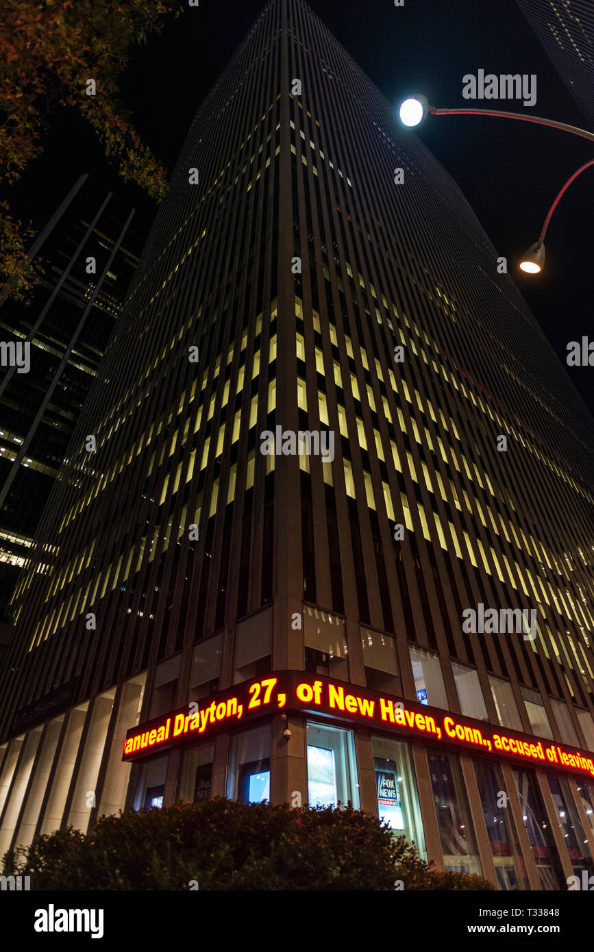 New York City, USA - July 28, 2018: Facade of headquarters and studios of Fox News Studios of Rupert Murdoch at night in 1211 Avenue of the Americas ( Stock Photo