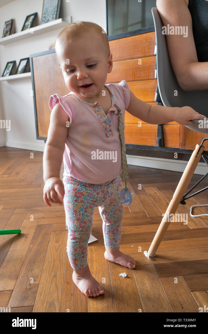 1 year old girl learning to walk Stock Photo