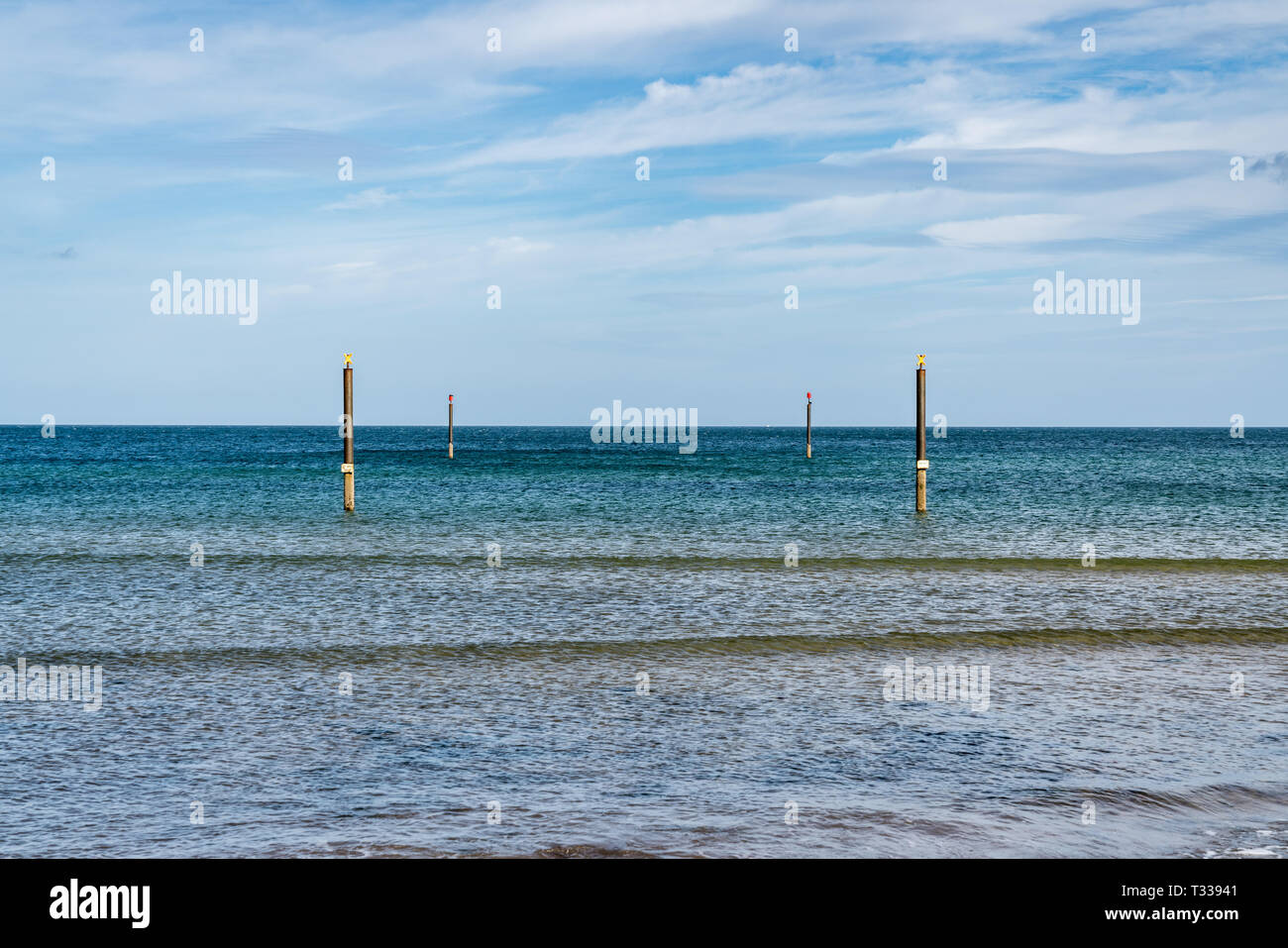 Piles in the North Sea, seen from North Beach in Cambois near Blyth, Northumberland, England, UK Stock Photo