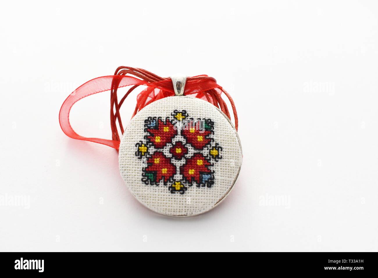 Handmade Cross Stitch Necklace Red Flower embroidered on white canvas Stock  Photo - Alamy