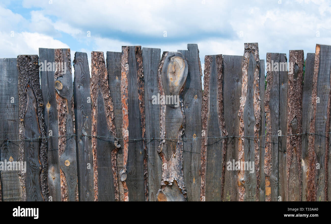 Rustic wooden boards fence with texture at skies background Stock Photo