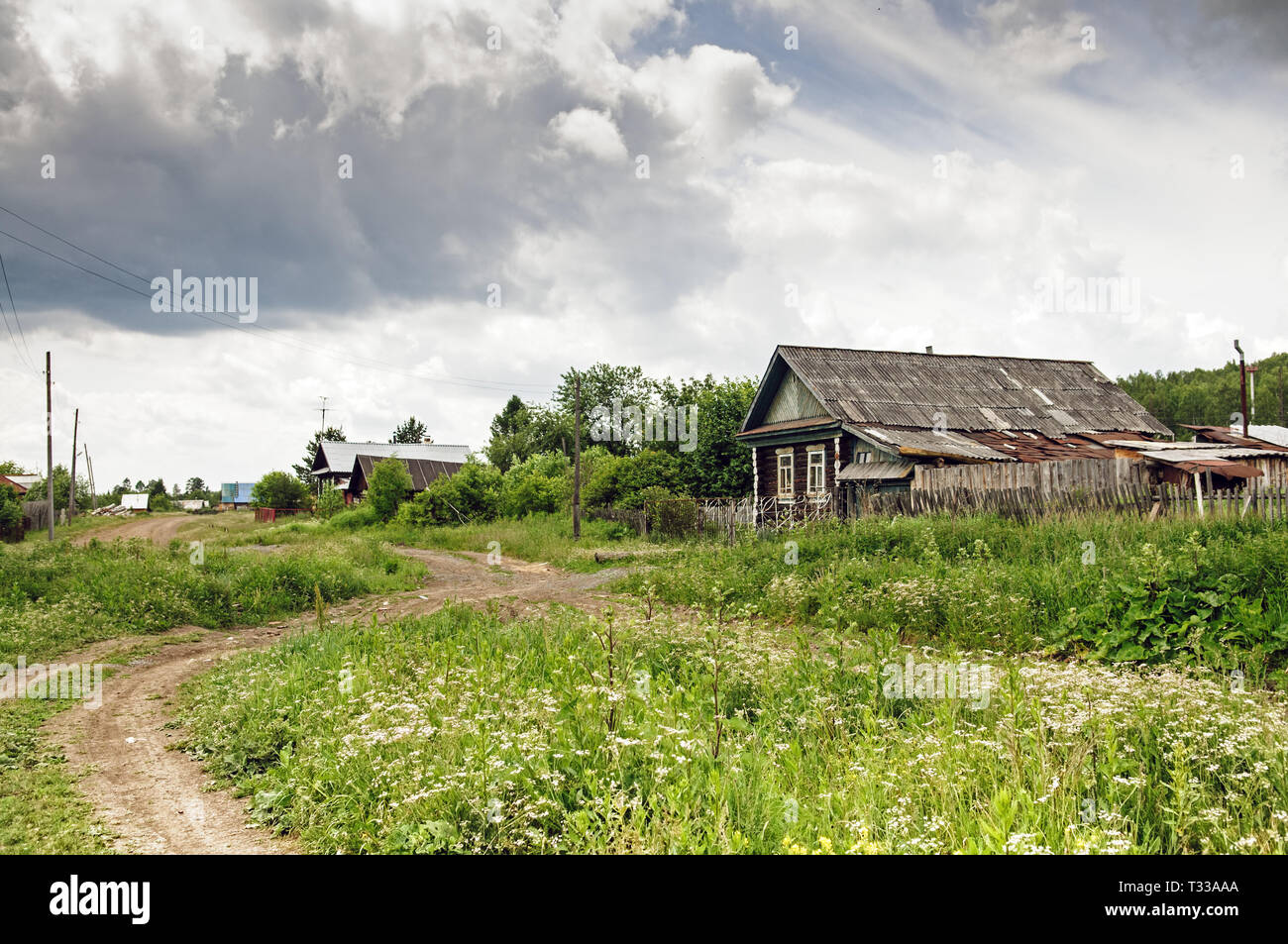 Russian village in summer cloudy day Stock Photo