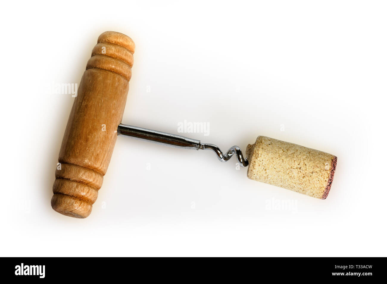 Corkscrew with wine cork isolated on white. Top view. Clipping path included Stock Photo