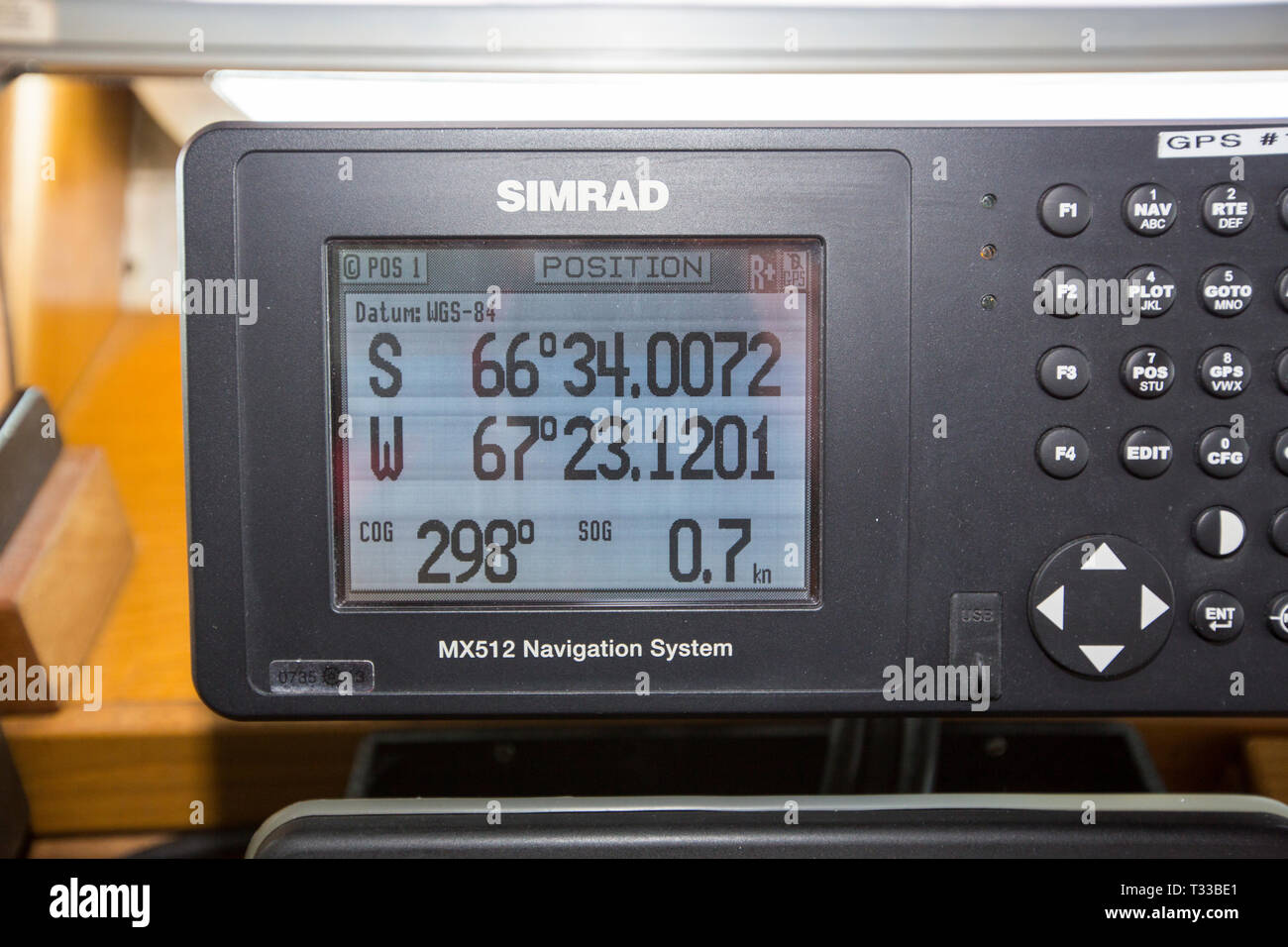 A GPS on the bridge of an Antarctic cruise ship showing the latitude and logitude when the ship reached the polar circle. Stock Photo