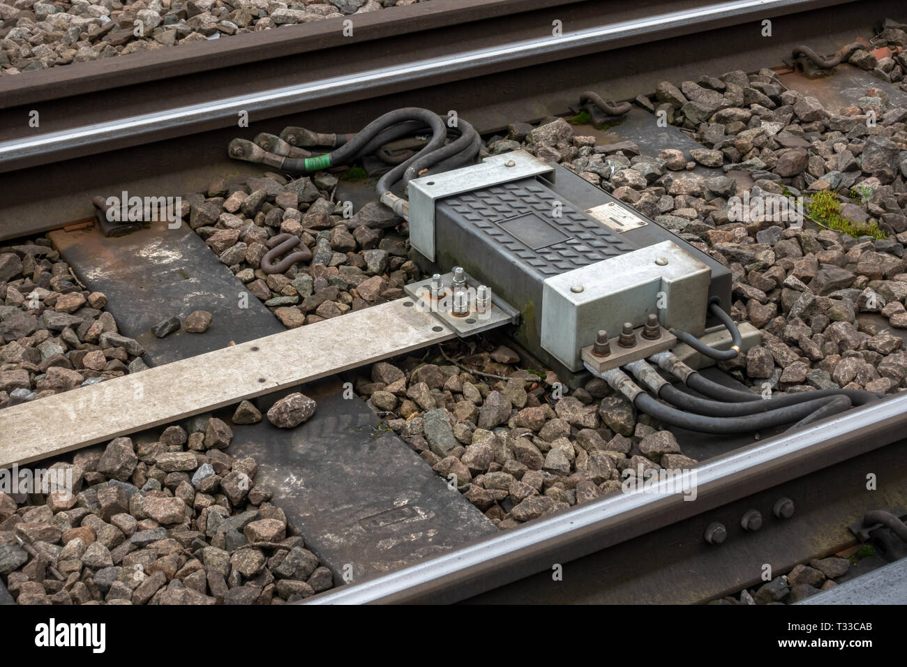 Railway Impedance bond provides a continuous path around insulated block joints for return current and to confine alternating signalling current to it Stock Photo