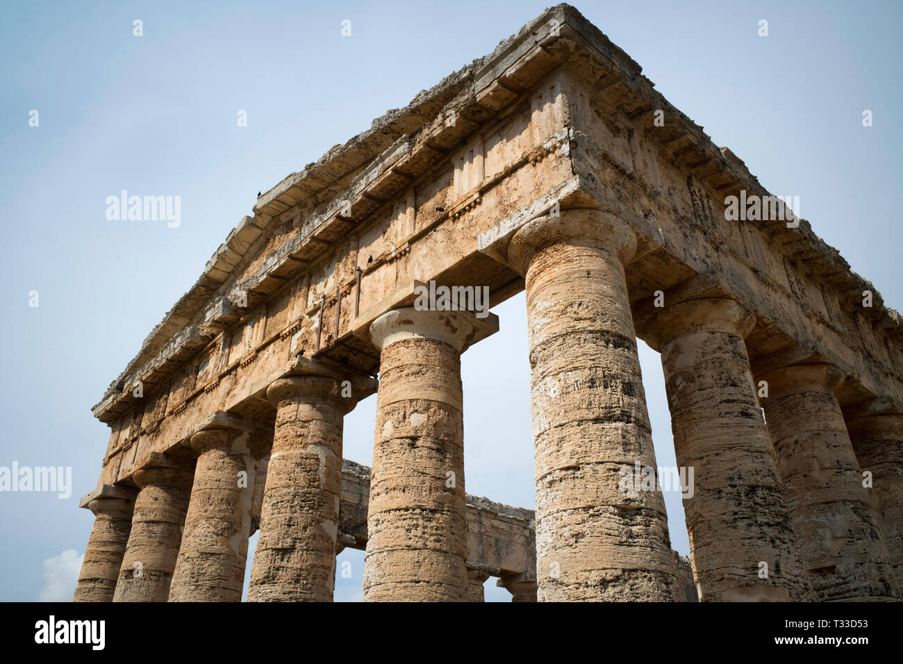 Tourists visiting the ancient ruins of the stone Doric Temple of Segesta, Sicily, Italy Stock Photo