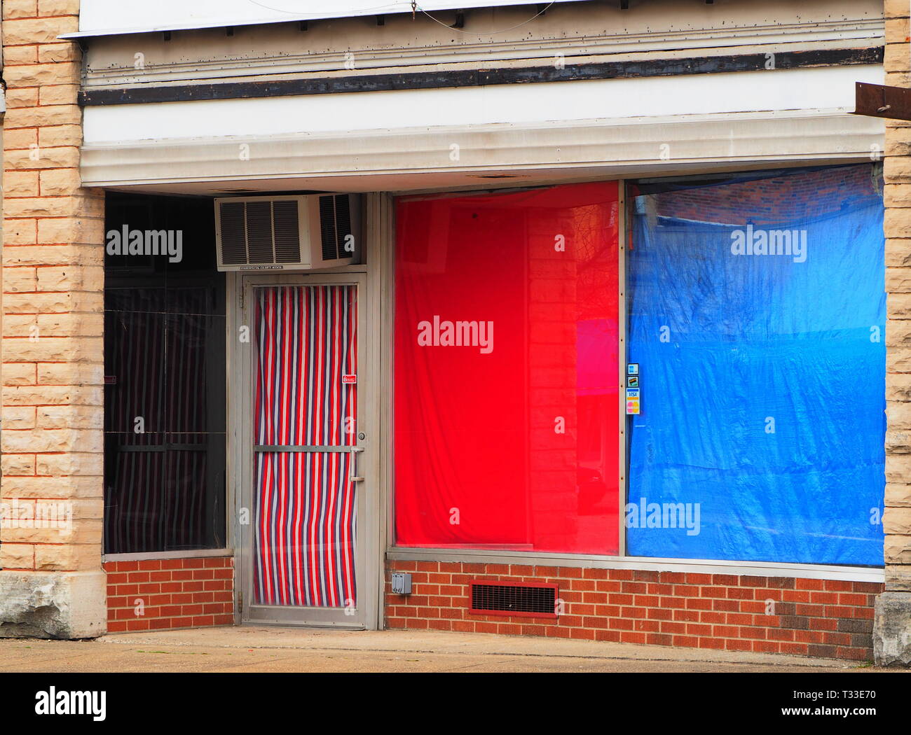 Abandoned small town abandoned store small shop store front with red