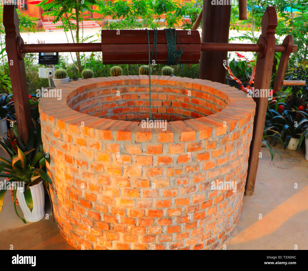 Dug water well is a structure created in the ground by digging to access groundwater in underground aquifers - cultural heritage preservation Stock Photo