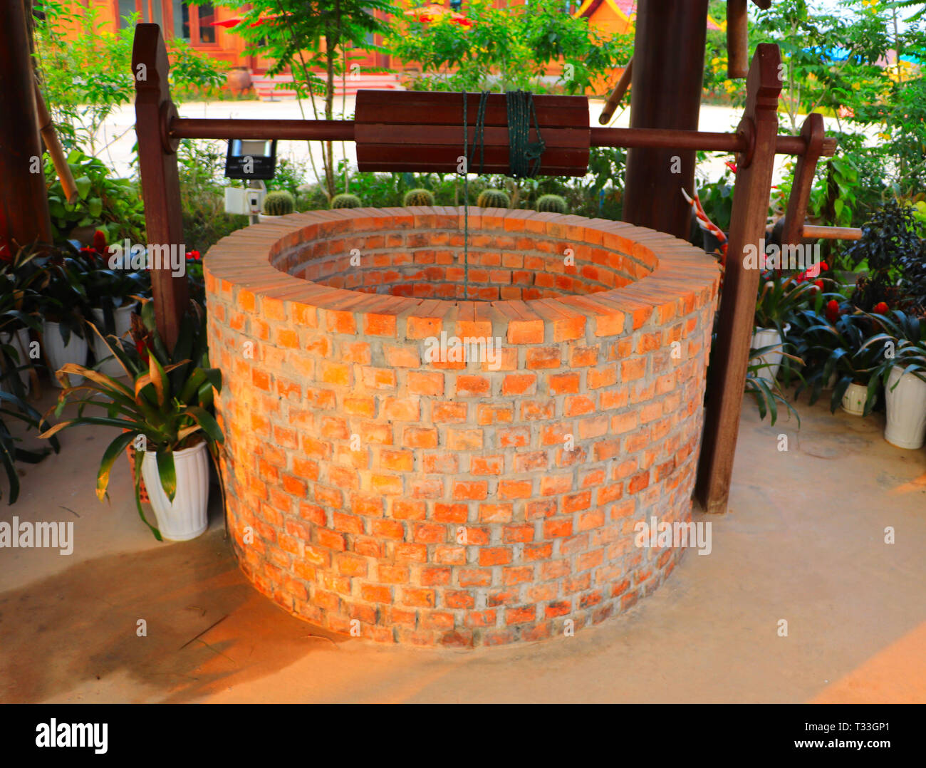 Dug water well is a structure created in the ground by digging to access groundwater in underground aquifers - cultural heritage preservation Stock Photo