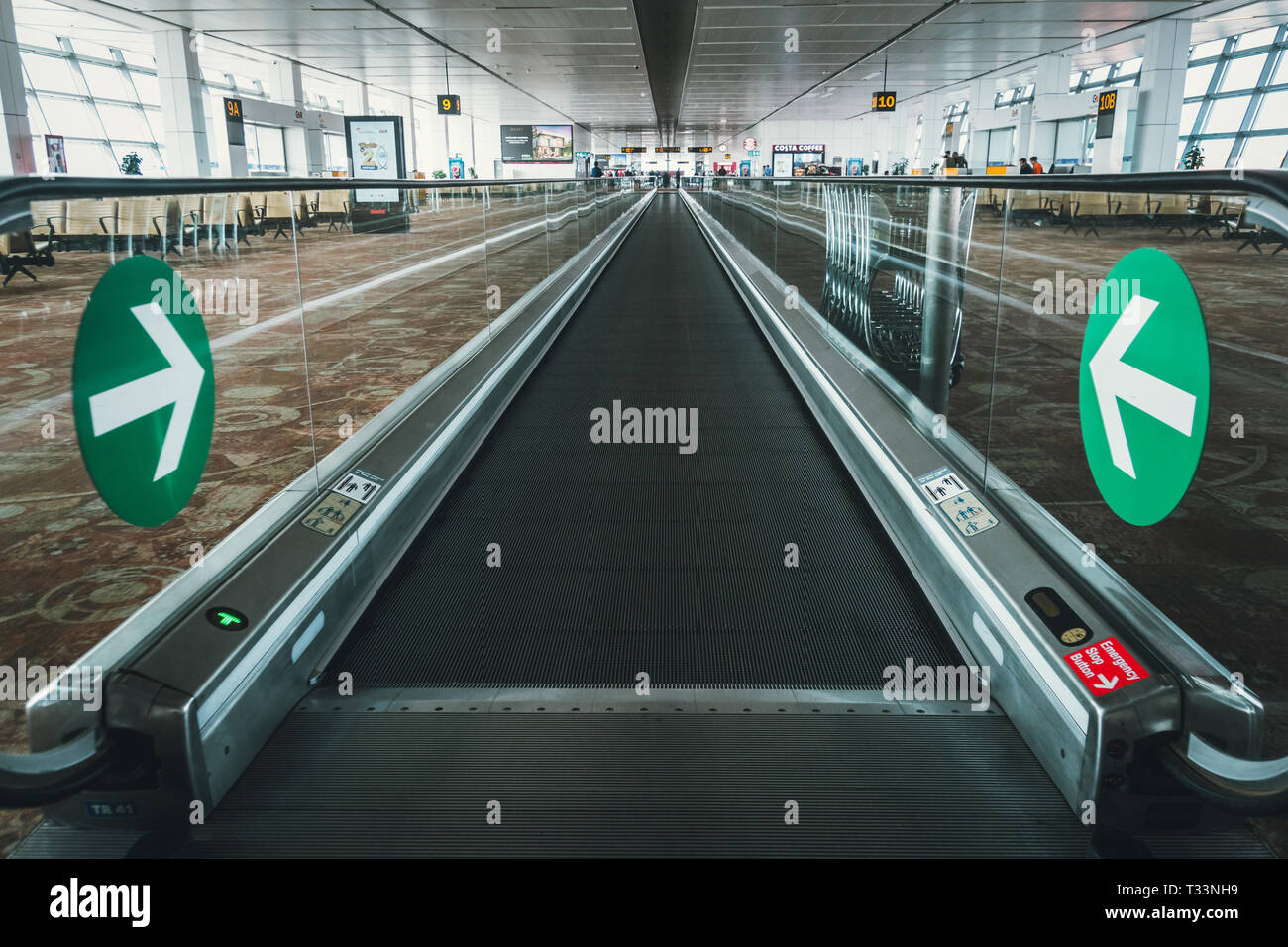 People on the escalator at the airport of Indira Gandhi International Airport, Terminal 3, New Delhi India , 28 January 2018 Stock Photo