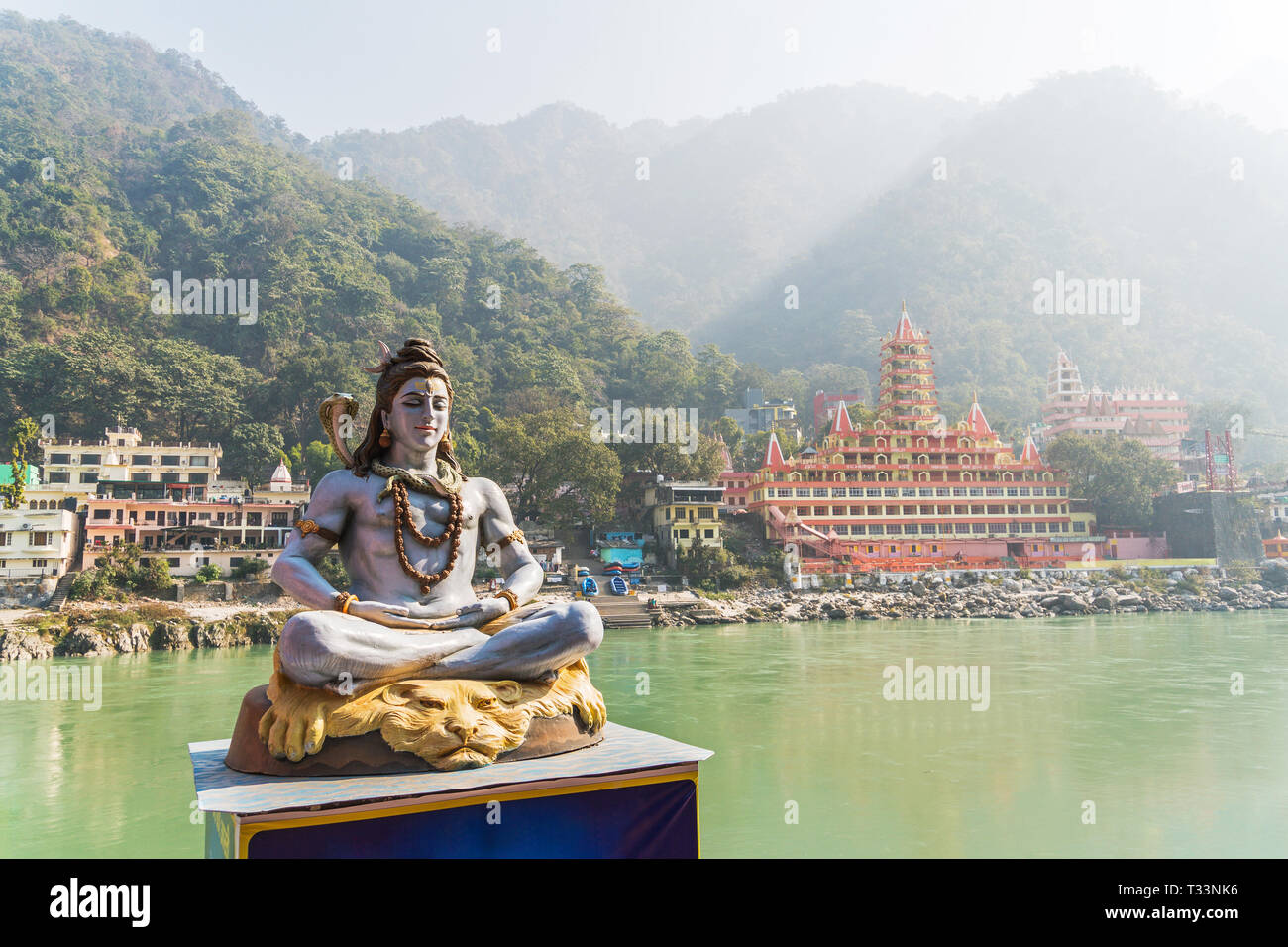 Statue Shiva, hindu idol on the river Ganges, Rishikesh , India Stock Photo