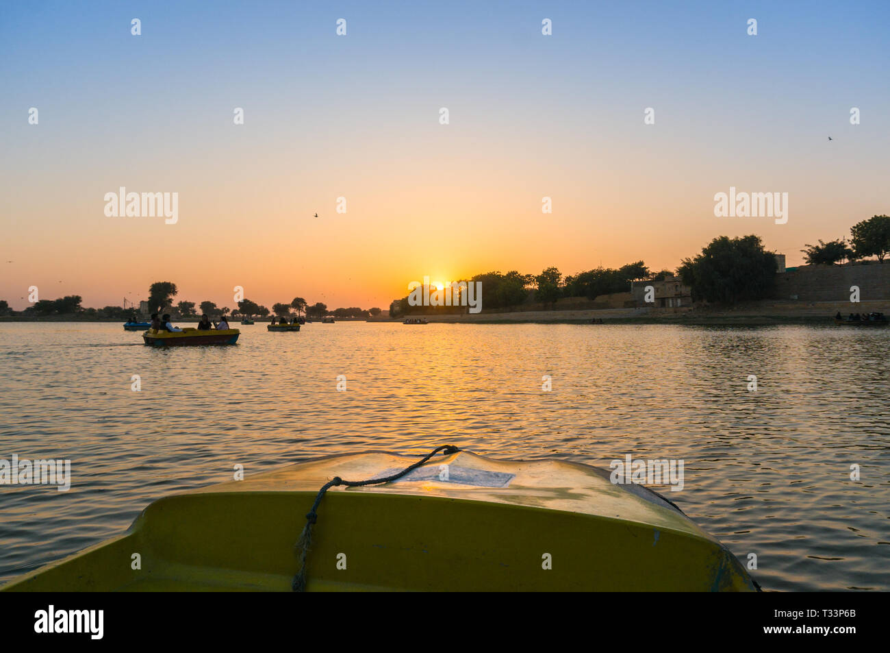Shot from boat of sunset at gadi sagar lake jaisalmer  Stock Photo