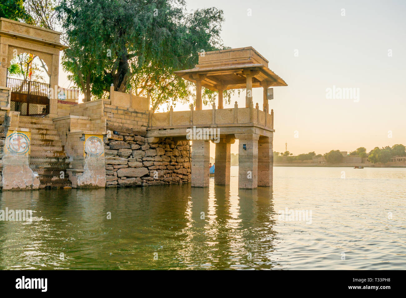 Central island park with sandstone buildings and trees growing at gadi ...