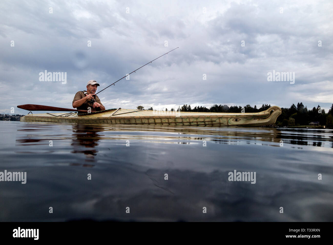 WA09975-00...WASHINGTON - Phil Russell fishing in Lake Stevens. (MR# R8) Stock Photo