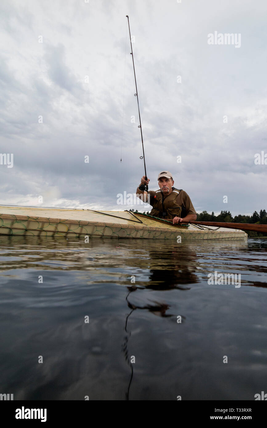 WA09978-00...WASHINGTON - Phil Russell fishing in Lake Stevens. (MR# R8) Stock Photo