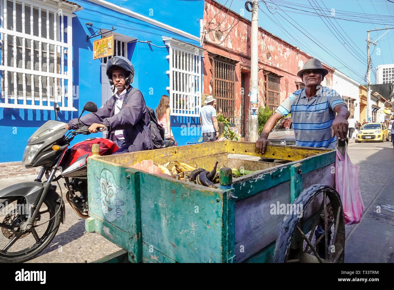 Cartagena Colombia,Center,centre,Getsemani,Hispanic resident residents,man men male,street roving banana plantain fruit produce vendor rolling cart,mo Stock Photo