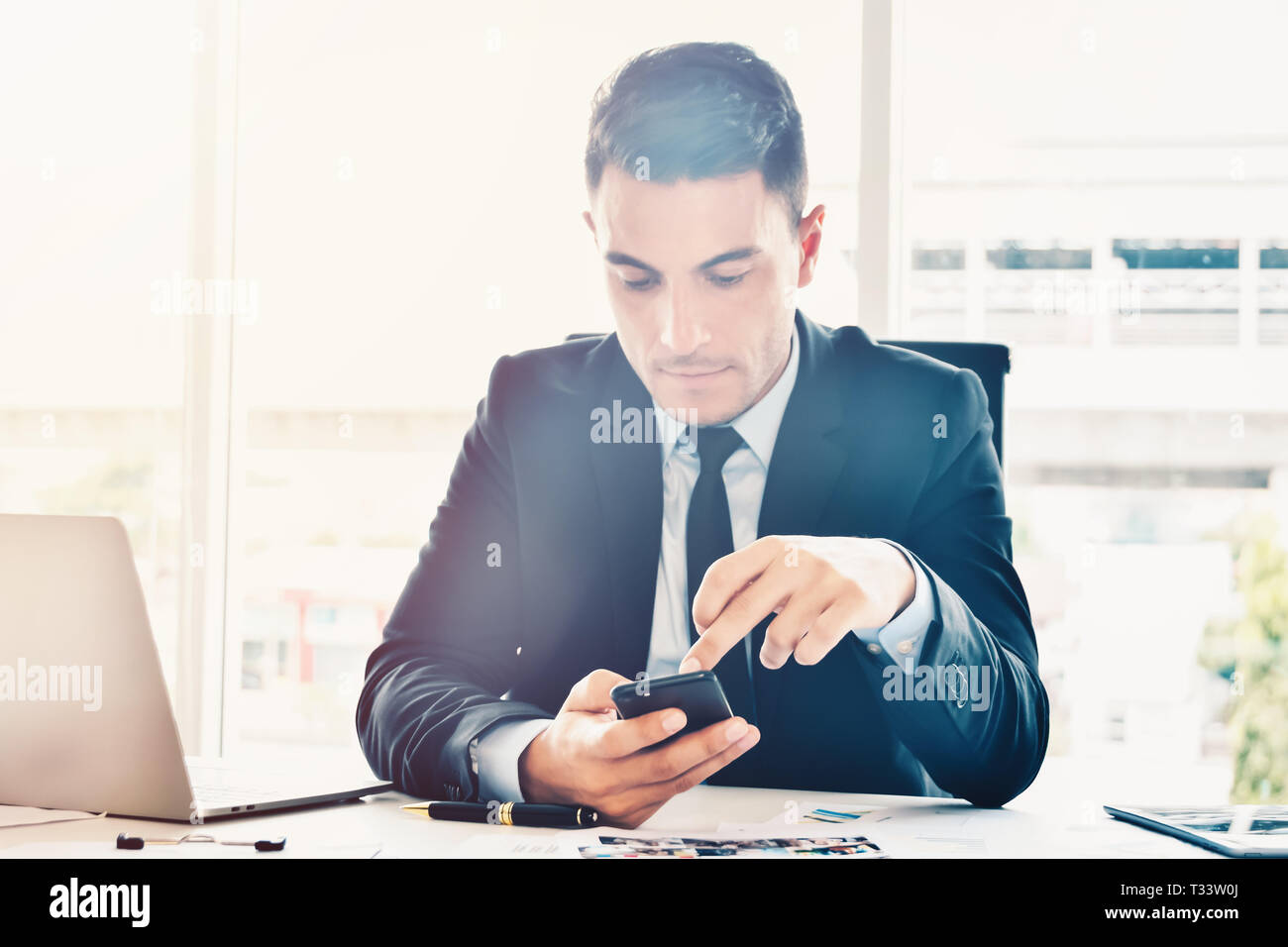 Manager searching online informations and data for business in bright modern office Stock Photo