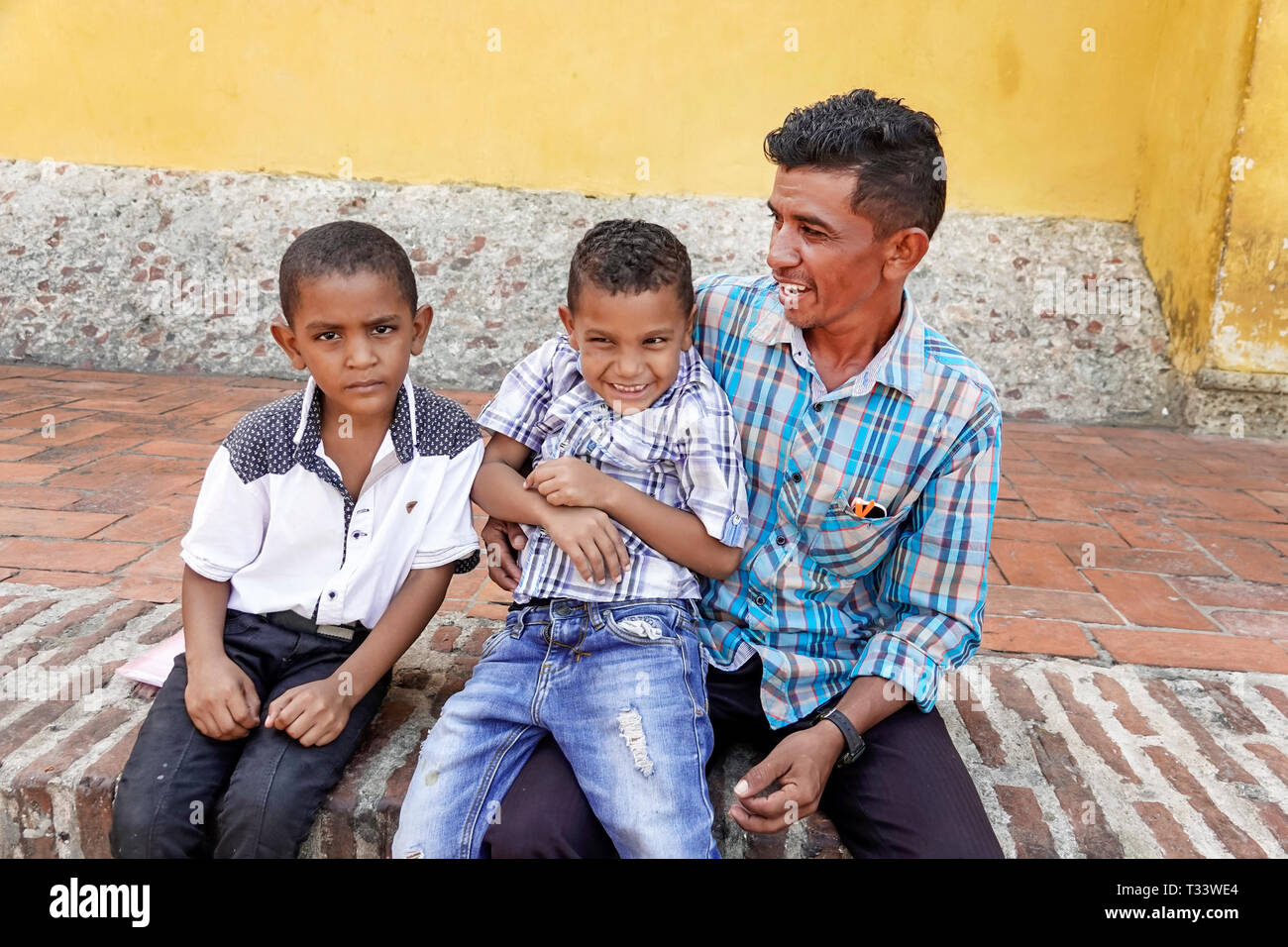Cartagena Colombia,Center,centre,Getsemani,Hispanic resident residents,man men male,father,son sons,boy boys,male kid kids child children youngster,bo Stock Photo