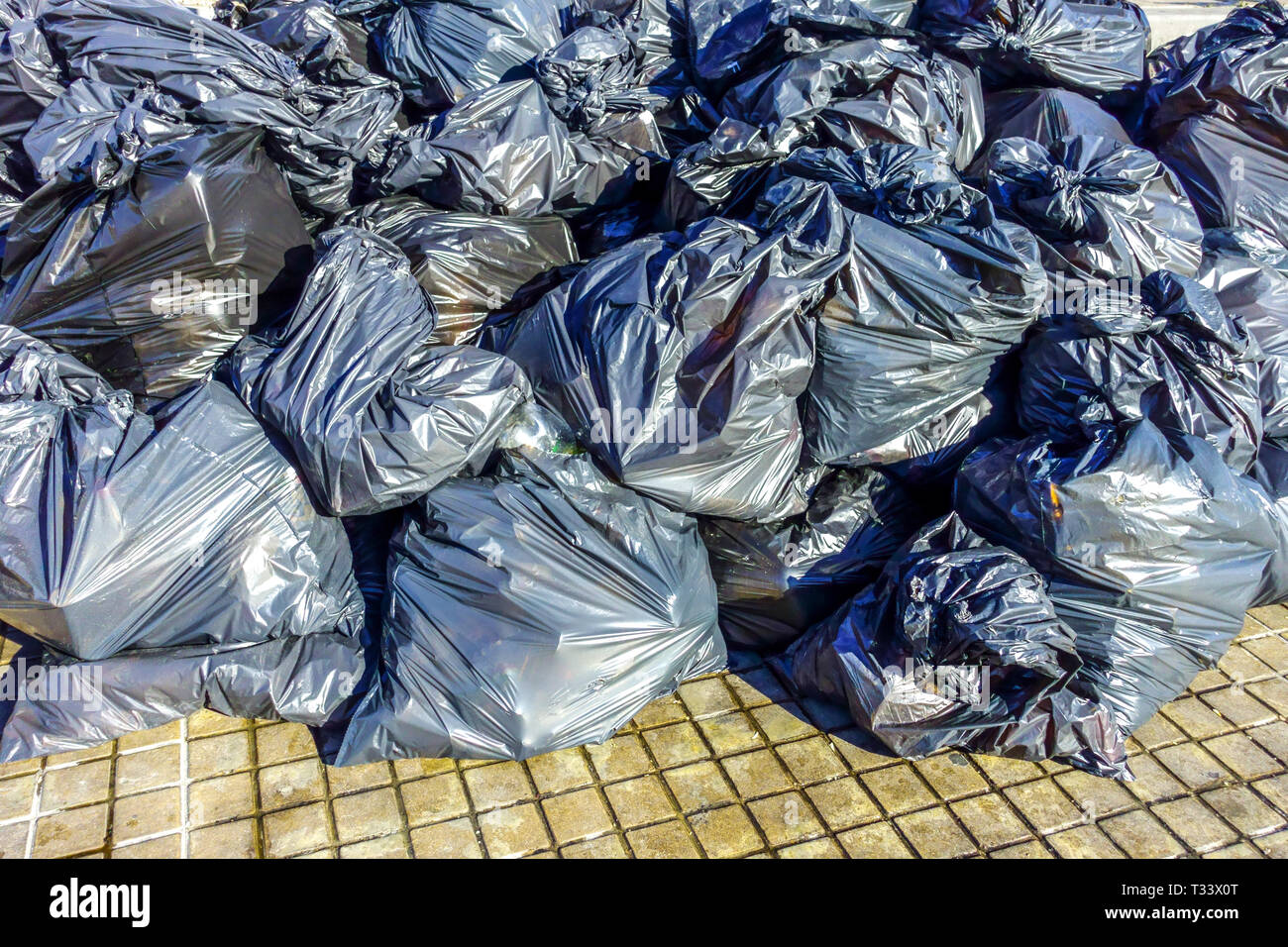 Black plastic bags filled with waste Stock Photo