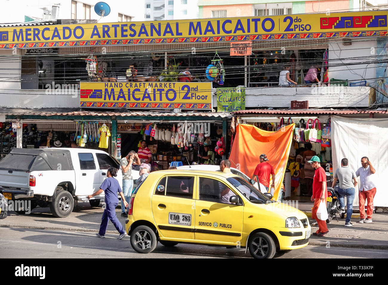 Cartagena Colombia,Bocagrande,artisanal flea market handicrafts,front entrance,yellow taxi taxis cab cabs,shopping shopper shoppers shop shops market Stock Photo
