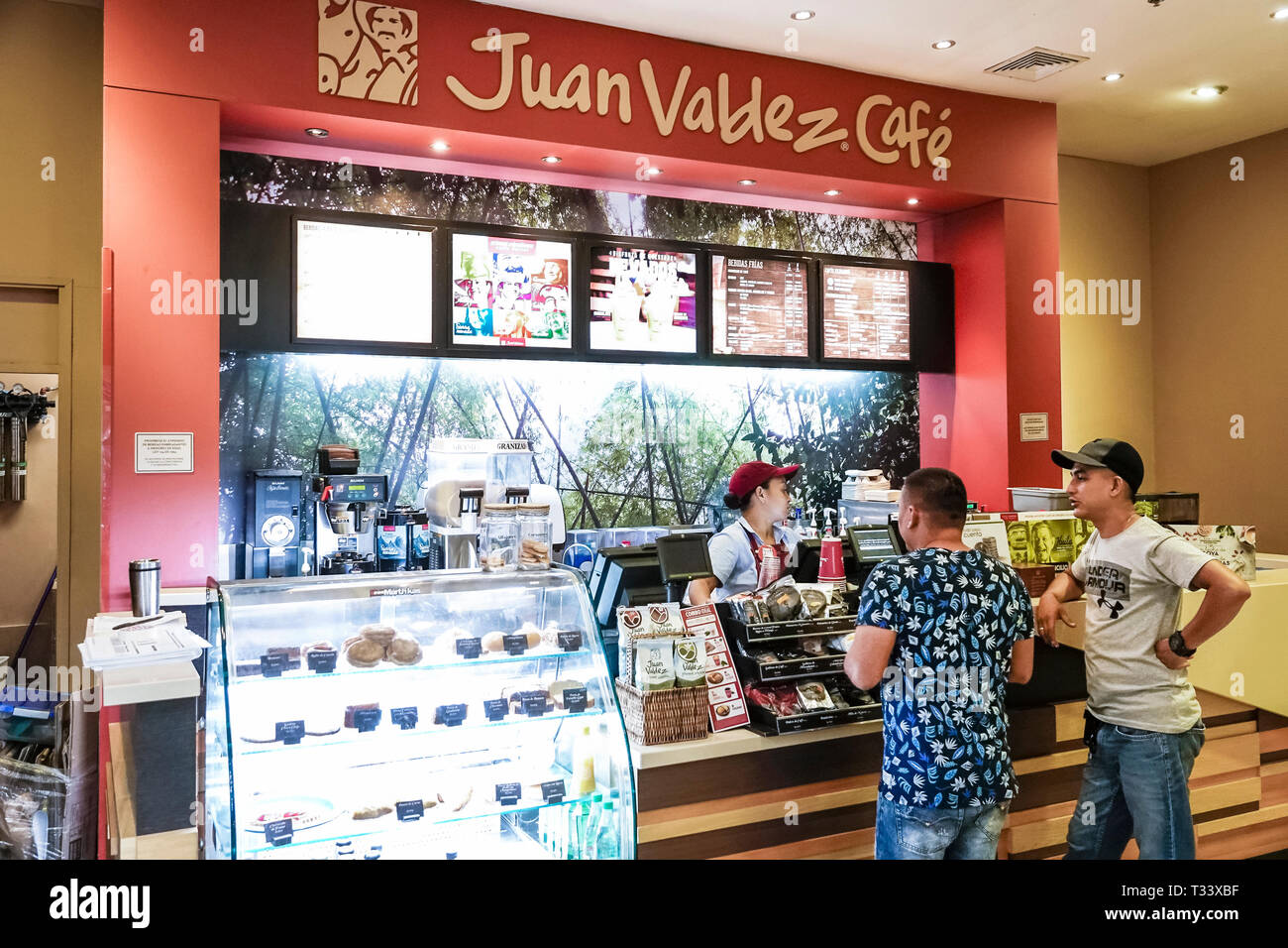 Cartagena Colombia,Bocagrande,Centro Comercial Nao plaza indoor mall,Juan Valdez Cafe coffee counter,Hispanic resident residents,man men male,woman fe Stock Photo