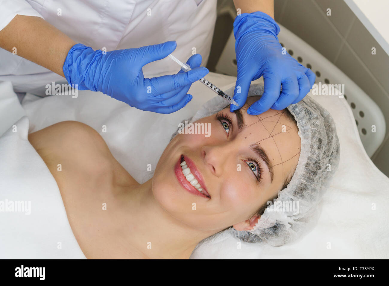 Aesthetic cosmetology. Hands cosmetologist injections of hyaluronic