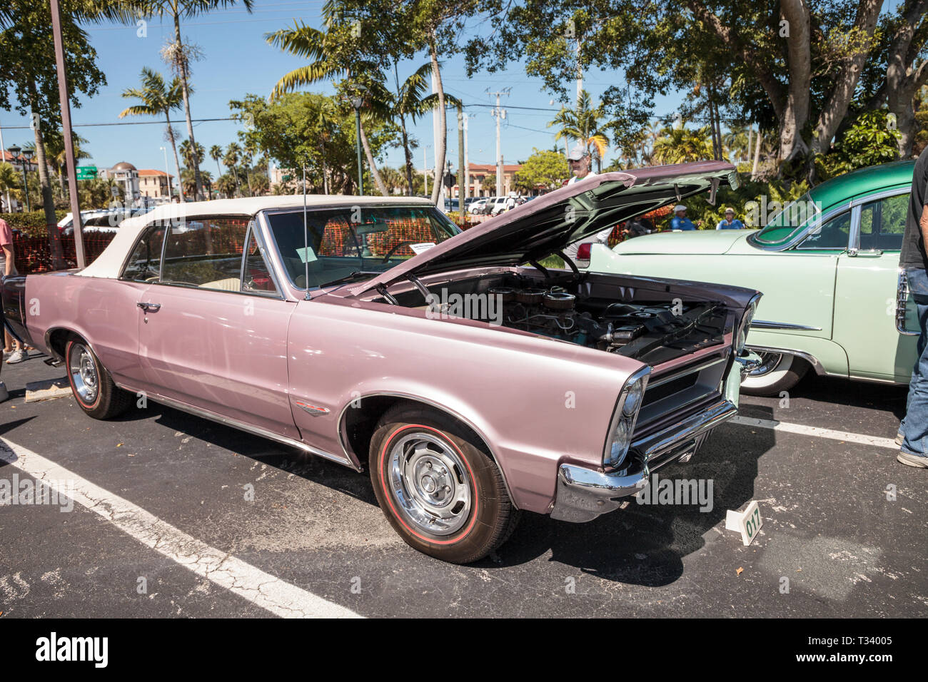 Naples, Florida, USA – March 23, 2019: Pink 1965 Pontiac GTO at the 32nd Annual Naples Depot Classic Car Show in Naples, Florida. Editorial only. Stock Photo