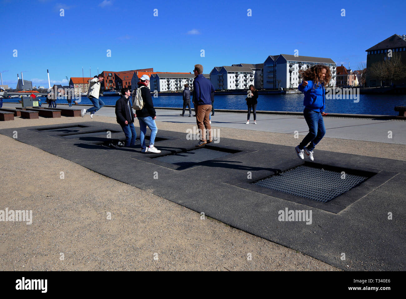 People jumping on public trampolines in Havnepromenade, Copenhagen, Denmark  Stock Photo - Alamy