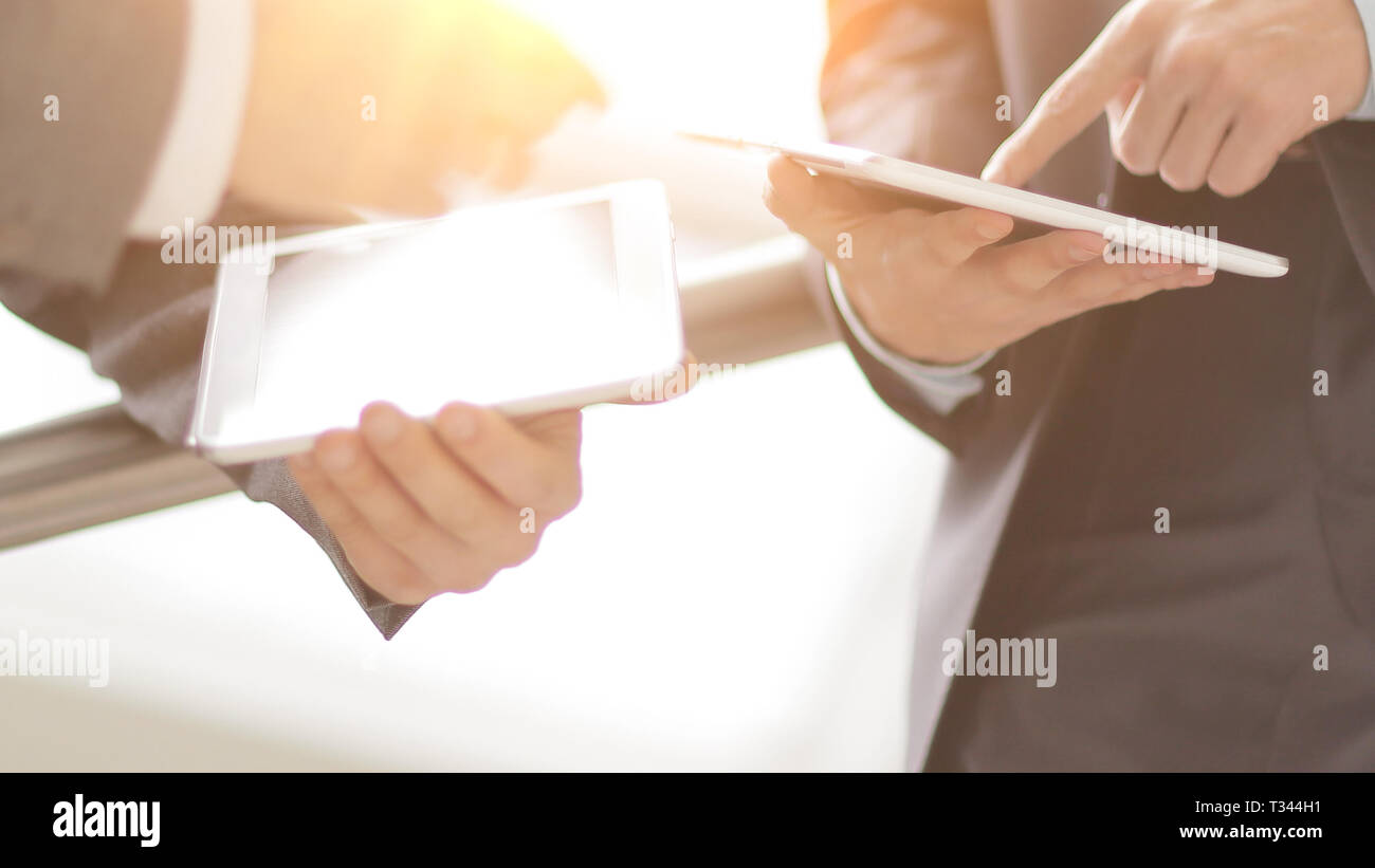close up. two businessmen with tablet computers Stock Photo
