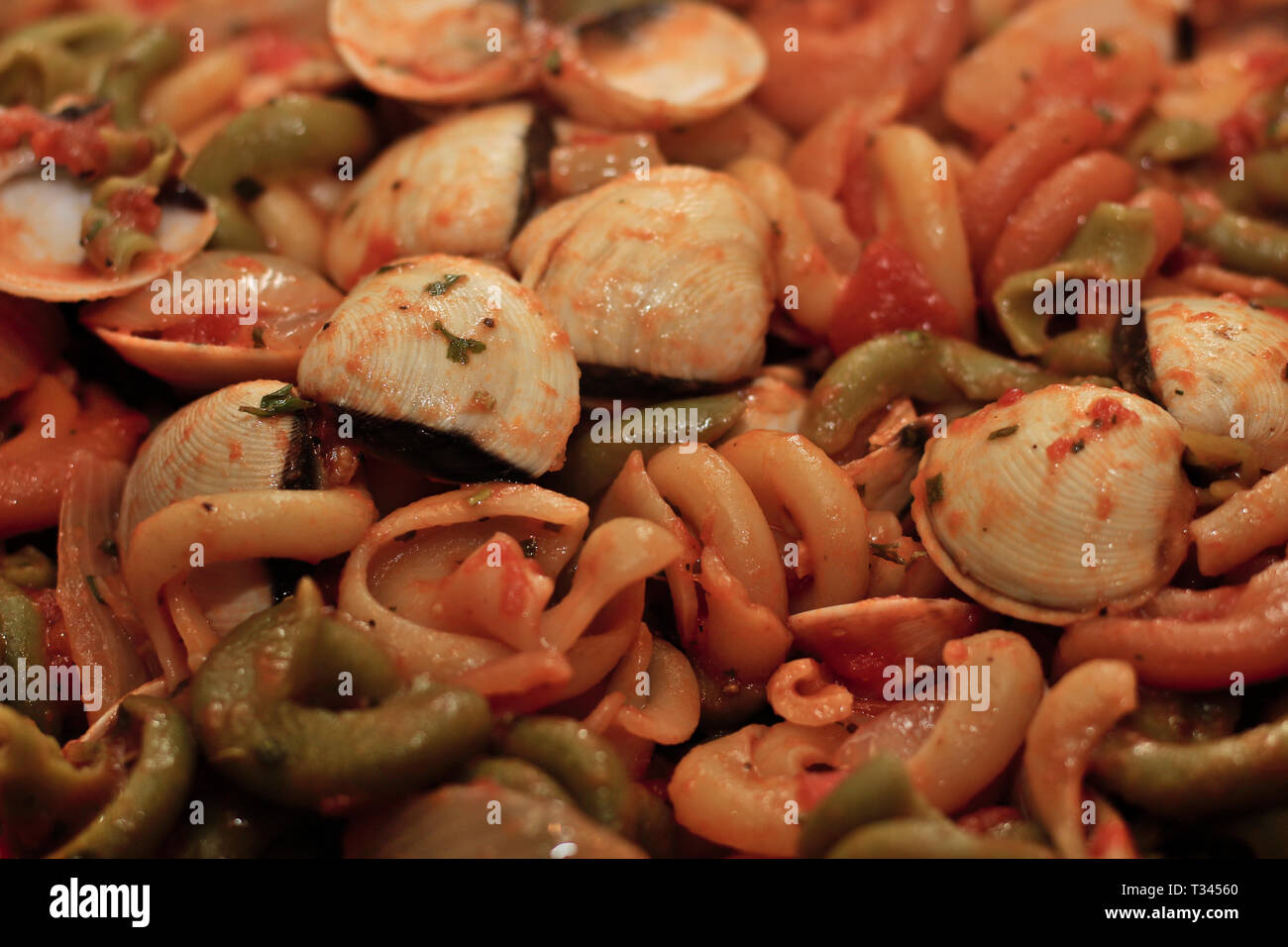 Cooked clams in paella Stock Photo Alamy