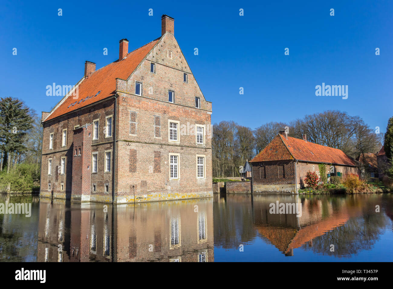 Historic House Welbergen With Reflection In The Water In Ochtrup