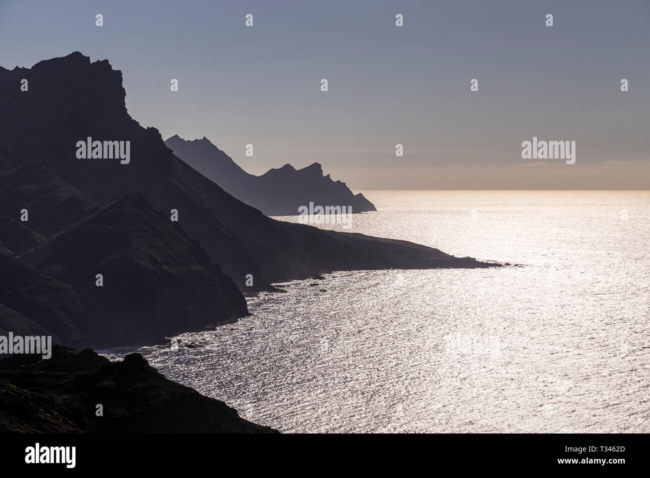High sea cliffs in silhouette at Tamadaba on the Atlantic coast of Gran Canaria, Canary Islands Stock Photo