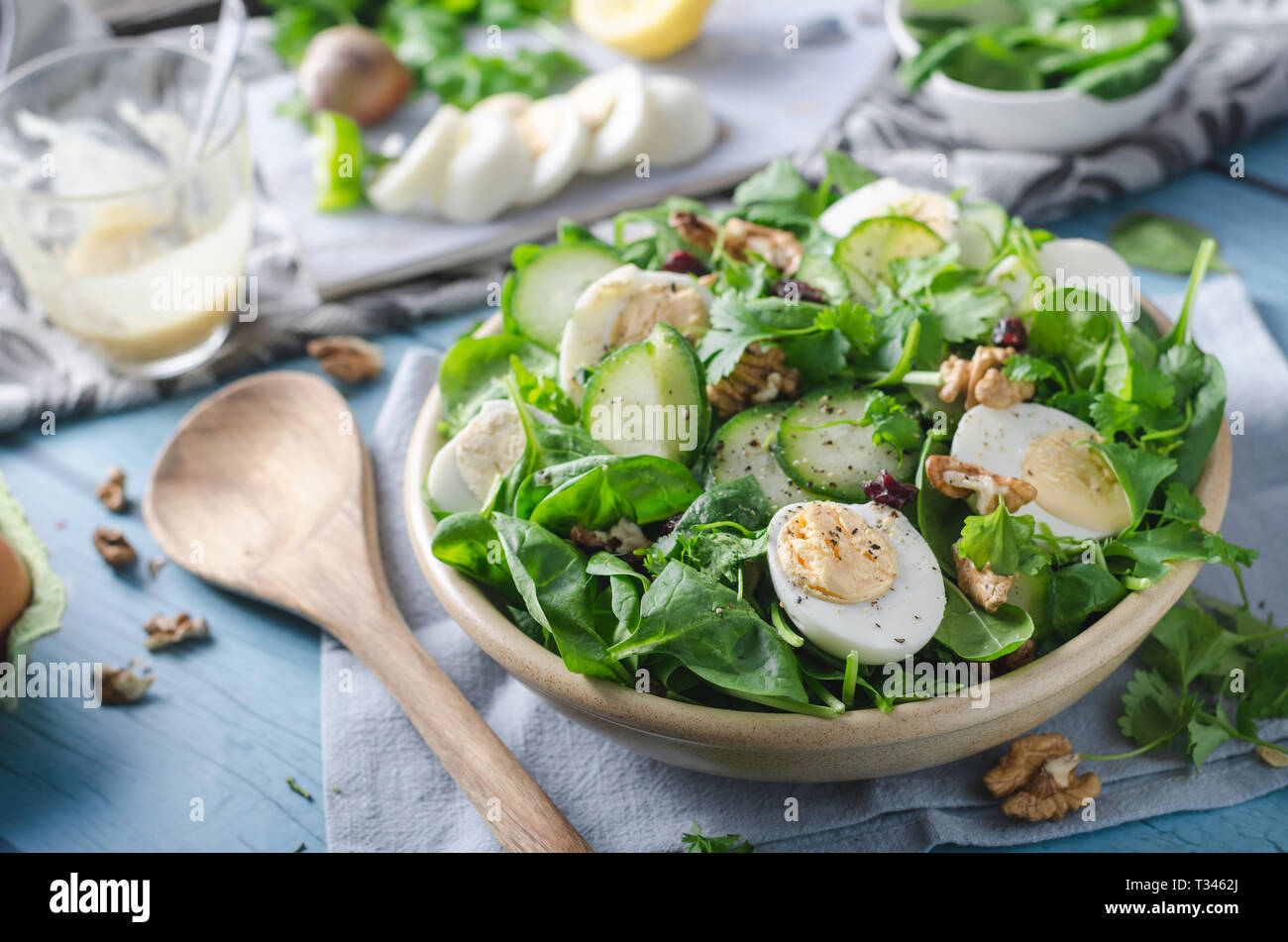 Delicious and simple healthy salad with nuts, eggs and cucumber Stock