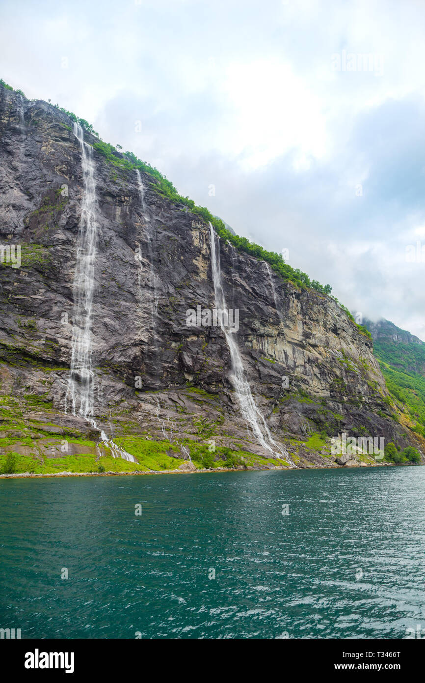 Geiranger fjord, Norway, landscape with mountains and waterfalls Seven Sisters at summertime. Stock Photo