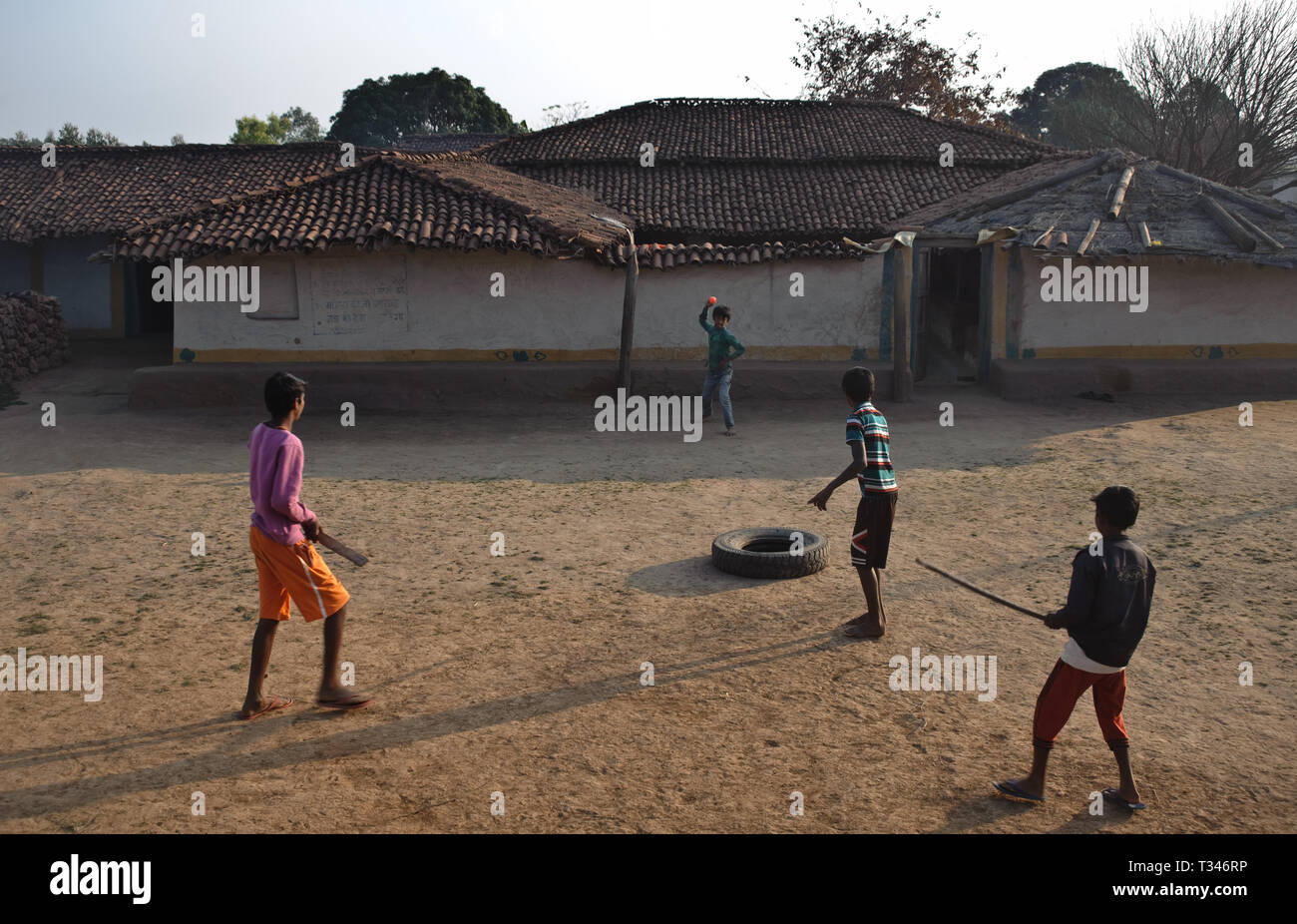 Boys are playing cricket in rural India Stock Photo
